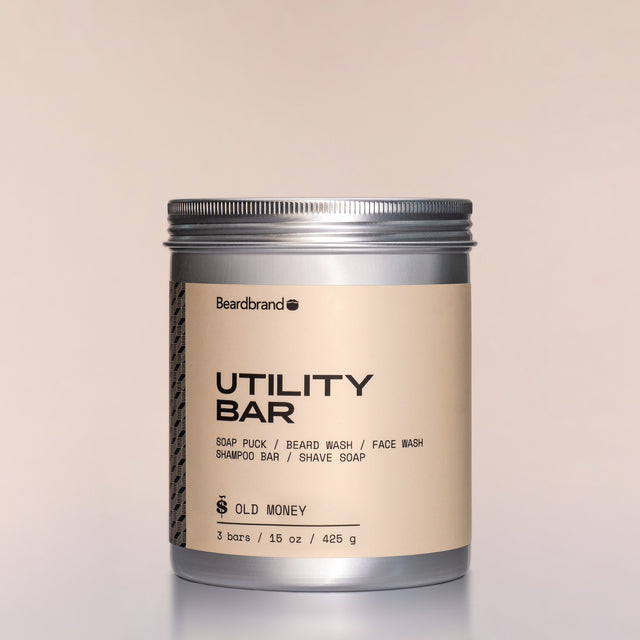 A container of Old Money Utility Bars against a neutral background.