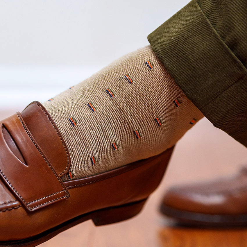 khaki merino wool patterned dress socks with olive green trousers and brown penny loafers