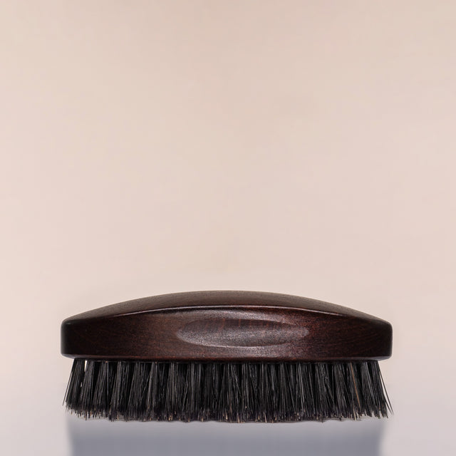 A Beardbrand 100% Boar’s Hair Oval Brush side view.