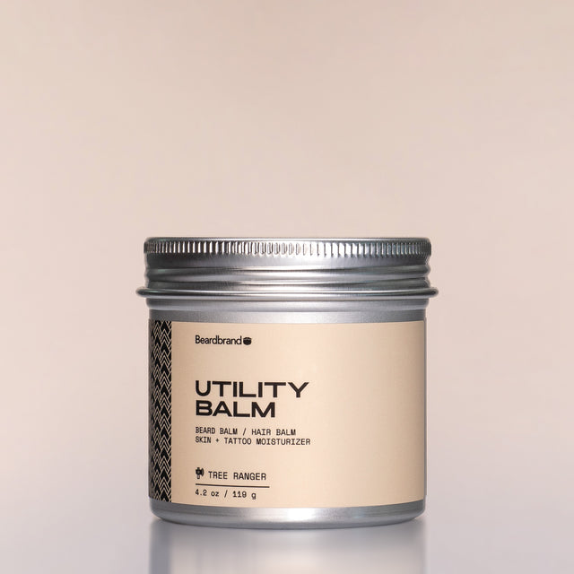 A container of Tree Ranger Utility Balm against a neutral background.