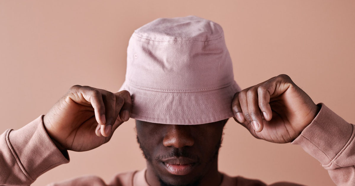 man wearing pink bucket hat